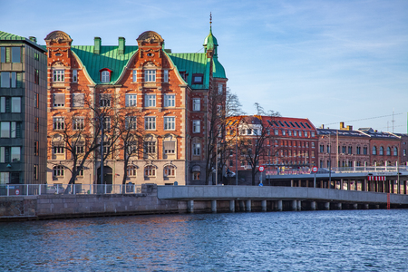 front view of cityscape with buildings and river in Copenhagen, Denmarkの写真素材