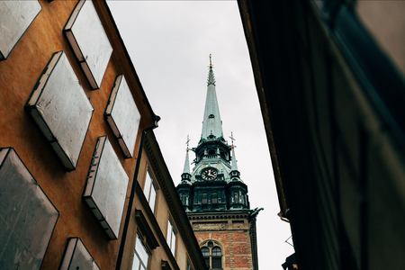 low angle view of historical Riddarholmen church tower in Stockholm, Swedenの写真素材