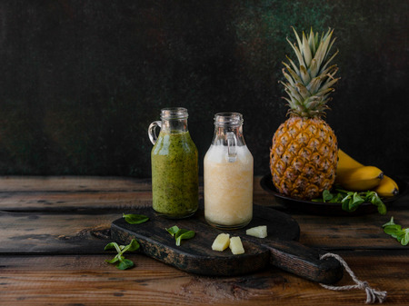 Delicious exotic fruits smoothie on rustic wooden boardの写真素材