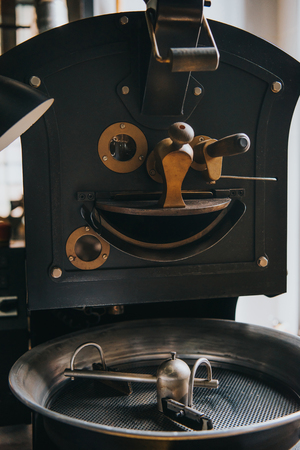Adjusting handles of machine for professional coffee productionの写真素材