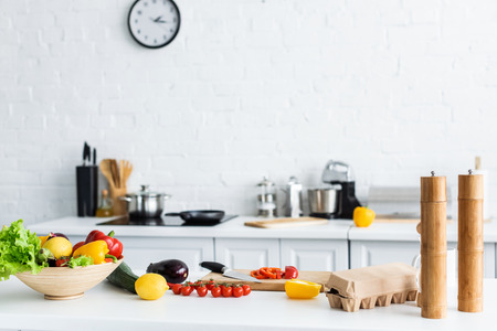 spices, egg box and fresh vegetables on kitchen tableの写真素材