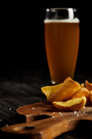 Set of junk food with french fries and cold beer in glassの写真素材