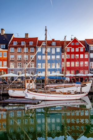 COPENHAGEN, DENMARK - MAY 6, 2018: boats and beautiful historical buildings reflected in calm water, copenhagen, denmarkのeditorial素材