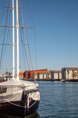 COPENHAGEN, DENMARK - MAY 6, 2018: yacht moored in harbour and beautiful cityscape in copenhagen, denmarkのeditorial素材