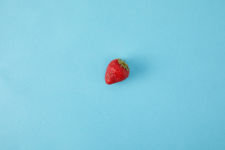 top view of ripe strawberry isolated on blueの写真素材