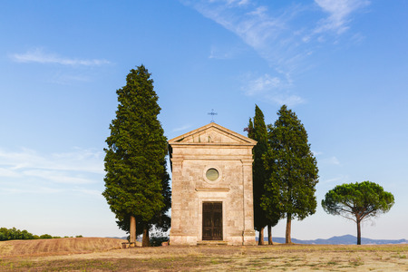 scenery with historical church and green trees, Tuscany, Italyの写真素材
