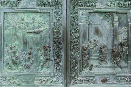 close up of antique metal high relief and ornament on door, Pisa, Italyの写真素材