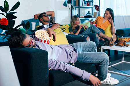 drunk young friends sleeping and lying after home party