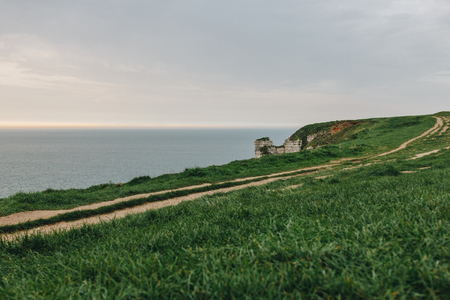 beautiful green meadow on cliff over sea at Etretat, Franceの写真素材