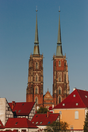 ancient Cathedral of St John Baptist in front of blue sky, Wroclaw, Polandの写真素材