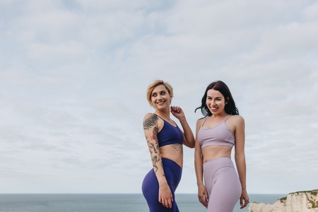 beautiful girls posing in stylish sportswear, Etretat, Normandy, Franceの写真素材