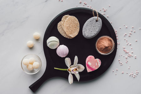 top view of various natural body care accessories on white, spa treatment conceptの写真素材