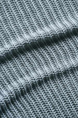 full frame image of wavy grey woolen fabric background