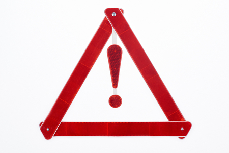 top view of red warning triangle road sign isolated on whiteの写真素材