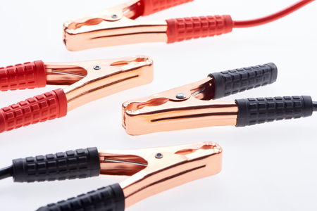 close up view of jump start cables isolated on whiteの写真素材