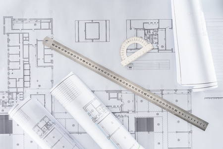 top view of architect blueprints with ruler and protractorの写真素材