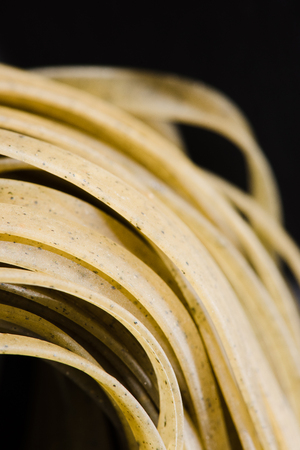 close-up shot of delicious raw spaghetti on blackの写真素材