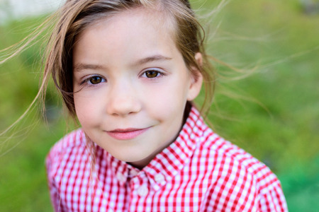 close up portrait of smiling little child on blurred backgroundの写真素材