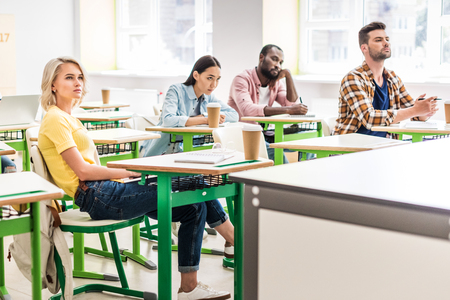 young students sitting in classroom during lessonの写真素材