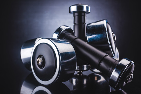 close-up view of various dumbbells and reflection, sport and healthy lifestyle conceptの写真素材
