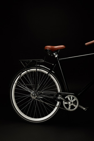 saddle, wheel and pedals of vintage bicycle isolated on blackの写真素材