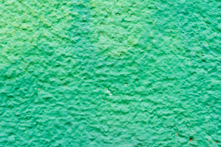 close-up view of bright green weathered wall textureの写真素材