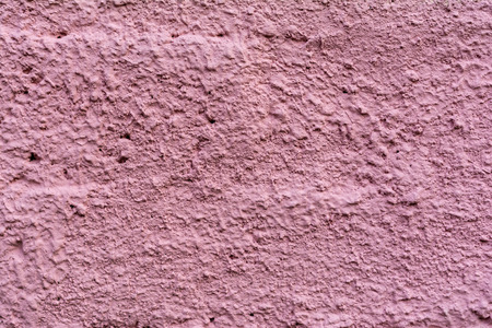 close-up view of old purple cement wall textured backgroundの写真素材