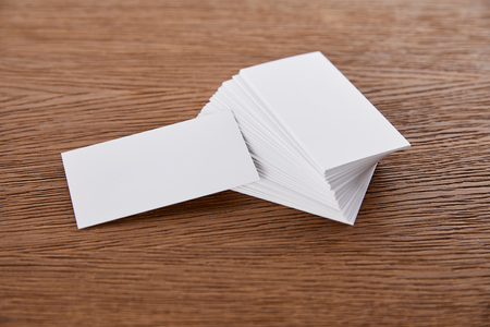 selective focus of stack of empty business cards at wooden tableの写真素材