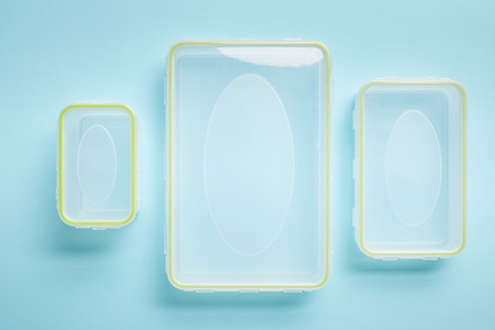 top view of empty food containers isolated on blueの写真素材