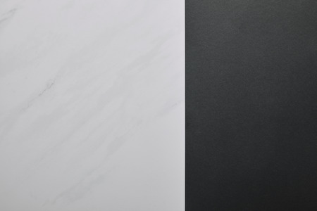 Blank black paper on white marble background