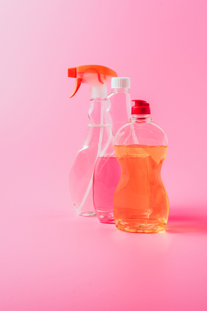 close up view of dishwashing liquid and cleaning fluids, pink backgroundの写真素材