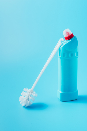 close up view of toilet brush and cleaning fluid, blue backgroundの写真素材