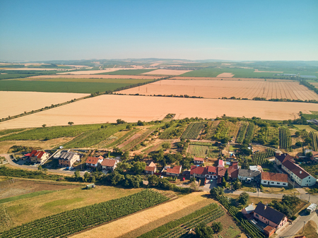 Aerial view of fields and houses, Czech Republicの写真素材