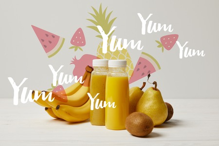 yellow detox smoothies in bottles with bananas, pears and kiwis on white background, yum yum yum...