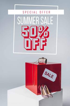 handbag, high heels and sale sign, summer sale concept with fifty offの写真素材