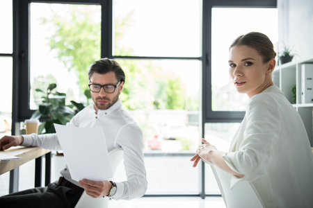 young confident managers working together at modern officeの写真素材