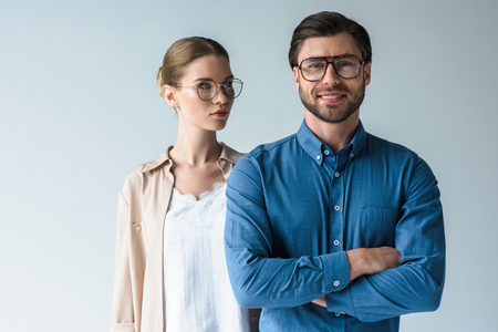 man and woman in stylish clothing and eyeglasses isolated on whiteの写真素材