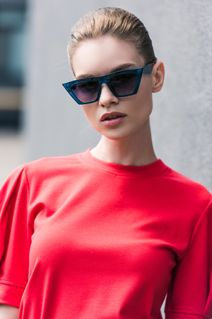 portrait of stylish young female model in sunglassesの写真素材