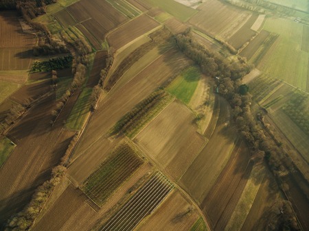 aerial view of beautiful agricultural fields on summer sunset, europeの写真素材