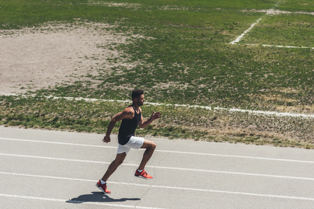 high angle view of male sprinter on running track at sport playground