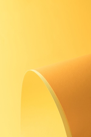 close-up view of beautiful bright yellow abstract paper backgroundの写真素材
