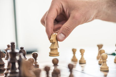 cropped shot of person playing chess, selective focusの写真素材