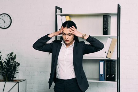 portrait of stressed businesswoman standing in officeの写真素材