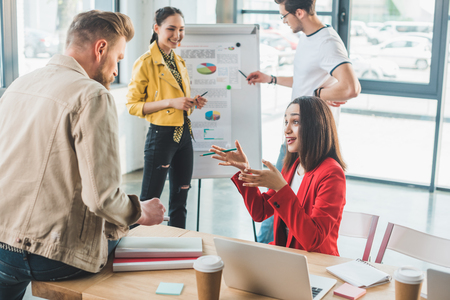 Professional colleagues discussing business results in modern officeの写真素材