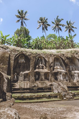 scenic view of ancient architecture of Temple Complex and Royal Tombs and green plants around, Bali, Indonesiaの写真素材