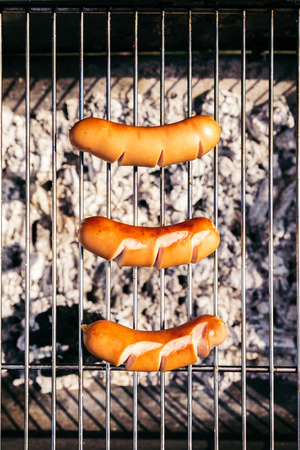 Top view of sausages cooked outdoors on grillの写真素材