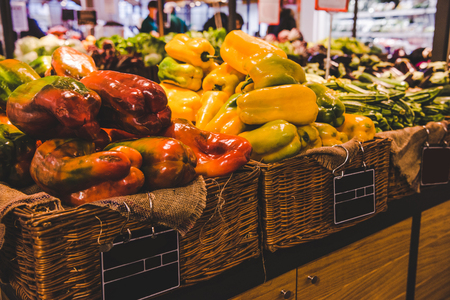 close-up shot of fresh bell peppers in baskets selling on farmers market, Rome, Italyの写真素材