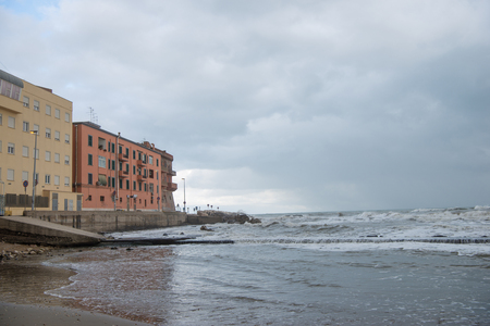 antique buildings over mediterranean sea on cloudy day, Anzio, Italyの写真素材