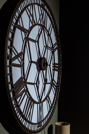 big vintage wall clock in modern green roomの写真素材