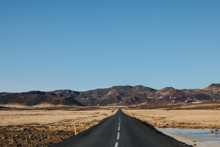 empty asphalt road in beautiful icelandic landscape, reykjanes, icelandの写真素材